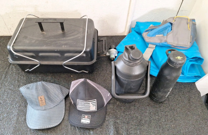 (1) Portable Propane Grill, (2) Water Bottles, (2) Baseball Caps, (1) Waist Pack & (1) Float Tube