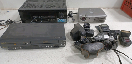 (3) Camera's - Canon A35F - Kowa Set R2 - Seagull DF-300 (3) Camera Attachments - Minolta Auto 200x - Minolta - Sunpak Auto 355AF Thyristor (1) Denon Integrated Network AV Receiver AVR-E400 (1) Symphonic VHS / CD Player Combo (1) Dell 2300MP Projector