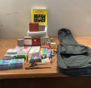 (1) Fabric Guitar Case (8) Avon Gift Collection Pieces (9) Different Cartridges and Tapes, A Set of School Supplies (1) Avon Perfume Collectors Encyclopedia (1) Single Drawer Storage Container