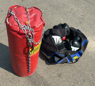 (1) Red Everlast Hanging Boxing Bag, (1) Bag Of Boxing Equipment Including Headgear, Boxing Gloves, Hand Wrap And More