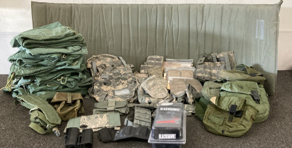 Military Surplus, (1) Green Sleep Mat, (19) Large Green Bags, (7) Small Camo Bags, (24) Variety Mag Holsters, (9) Small Green Bags, (1) Blackhawk Left Handed Holster ( Fits Beretta 92/96/M9/M9A1: Please iInspect.