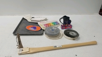 (7) Assorted Brushes/Grinders/Polishers, (2) Golf items, (1)Key tags, (1)Axe Handle, (1) White Leather Gun Holster, And more