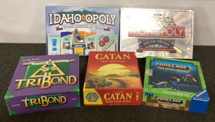 (5) Board Games, IdahoOpoly, Monopoly The America Special Edition, TriBond, Catan, Minecraft Builders And Biomes. Please Inspect.