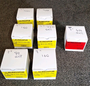 (7) BOXES OF 2" SCALLOPED SANDING DISKS, 80 GRIT, 100 GRIT, 150 GRIT , 220 GRIT, 320 GRIT & 400 GRIT & (1) BOX OF 2" ROUND SANDING DISKS, 600 GRIT