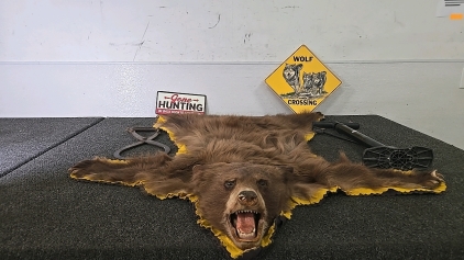 (1) Small Bear Pelt Rug (1) Tire Pump (1) Set of Ice Block Tongs (2) Signs