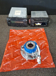 (1) FKG HUB ASSY, PART NUMBER 513137 & (2) CAR STEREOS