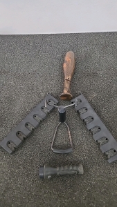 (2) Gun Case Attachments/ Arrow Notches (1) Slingshot (1) Flashlight (1) Wooden Bat with String Handle