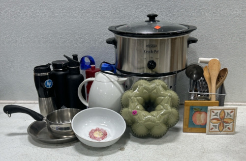 (1) Variety cookware box (1) Rival Crock pot (1) Tea kettle (1) Bunt cake pan (6) Water bottles