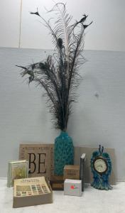 (1) Peacock vase with feathers (1) Peacock table clock (1) decorative tile (2) tiles-beige (1) box of song bird cards (1) wood box (1) Collectors Pat o’Day book (1) Vintage needlework box (1) Call to you senior assist (1) WiFi Reapter