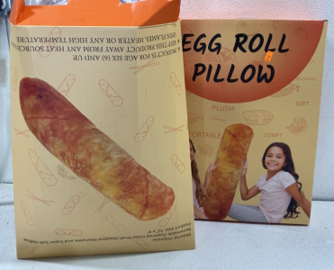 (2) New in box Egg roll Pillows