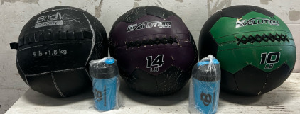 (1) 14LB Medicine Ball, (1) 10LB Medicine Ball, (1) 4LB Medicine Ball, And (2) Shake Cups