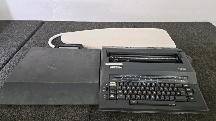 (1) Smith Carona Typewriter (1) Ironing Board