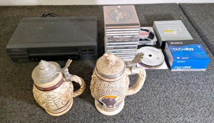 (2) PORCELAIN BEER STEINS (1) VHS PLAYER, ASSORTED MUSIC CDs & MORE