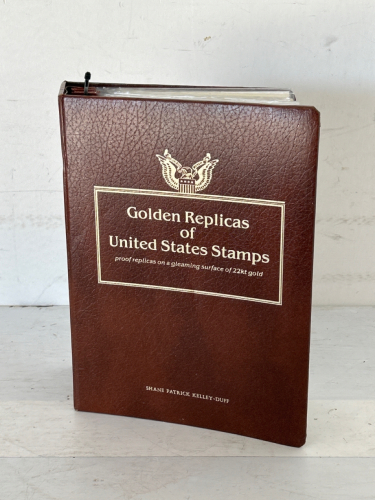 Brown Binder With Golden Replicas Of United States Stamps