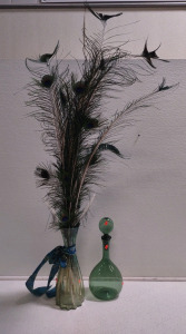 (1) Glass Vase Full of Peacock Feathers & (1) Green Blown Glass w/ Glass Cap