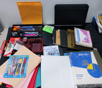 Pens pencils staplers notebooks paper can full of cards binders