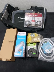 2 shower heads ( new) 1 tape measure ( new) 1 doorknob 1 grommet repair kit I small duffel type bag