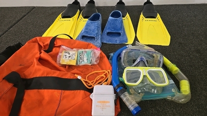 (3) Pairs of Diving Clippers (2) Bars of Sticky Bumps (2) Sets of Snorkeling Gear (1) Large Orange Duffel Bag