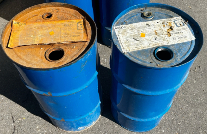 (2) Blue Barrels. Main Building