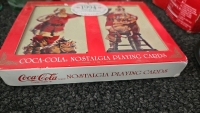 (1) Set of 4 Coca Cola Tin Coasters from 1983 (1) Set of Coca Cola Playing Cards from 1994 (1) 6-Pack of Coca Cola Classic Bottles of Soda from 1998 and so Much More Memorabilia - 10