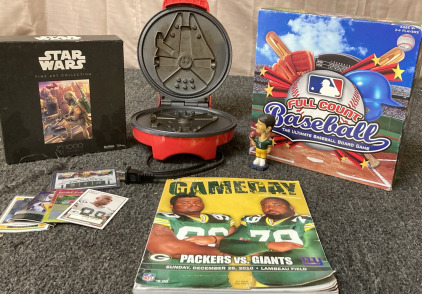 STAR WARS FINE ART COLLECTION 1000 PIECE PUZZLE, STAR WARS MILLENNIUM FALCON PANCAKE MAKER, FULL COUNT BASEBALL BOARD GAME, 2010 GREEN BAY PACKERS GAMEDAY PROGRAM MAGAZINE, 5 LOOSE FOOTBALL CARDS.