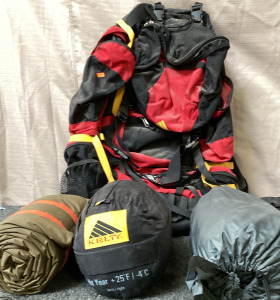 RED BACK PACK, 2 SLEEPING BAGS, 1 SMALL TENT.