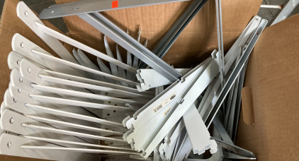 BOX OF CLOSET SHELVING BRACKETS.