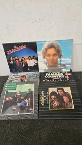 (1) Set of 31 Records Ranging From The Doobie Brothers to Olivia Newton John to The Oak Ridge Boys to Hank Williams Jr