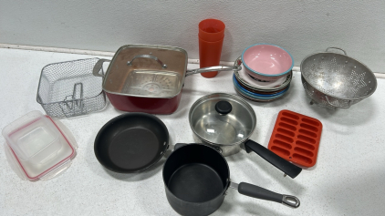 (4) Pots and pans (1) Stack of plates & bowl (1) Strainer and more!