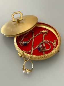Gold Toned Round Case With (2) Rings Marked .925 and (1) Gold Fillled Ring On Chain
