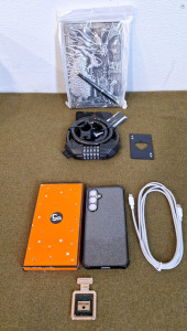 (1) Samsung S20FE Cell Phone Case Black, (1) USB-C To USB-C Cable, (1) Bike Lock, (1) Ace Card Bottle Opener & (1) Dragon Journal