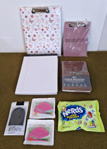 (2) Clipboards, 1-Big, 1-Small, (6) Pads Of White College Ruled Paper, (1) Check Register, (1) Pocket, Cell Phone Stand, (2) 3-Packs Of Letter Openers & (1) 6-Oz Bag Of Nerds Gummy Clusters