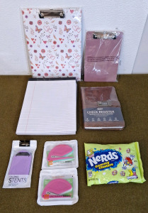 (2) Clipboards, 1-Big, 1-Small, (6) Pads Of White College Ruled Paper, (1) Check Register, (1) Pocket, Cell Phone Stand, (2) 3-Packs Of Letter Openers & (1) 6-Oz Bag Of Nerds Gummy Clusters