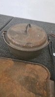 (1) Cast Iron Skillet (1) Cast Iron Dutch Oven (2) Cast Iron Griddles (1) Dutch Oven Lid Lifter - 8