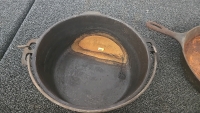 (1) Cast Iron Skillet (1) Cast Iron Dutch Oven (2) Cast Iron Griddles (1) Dutch Oven Lid Lifter - 9