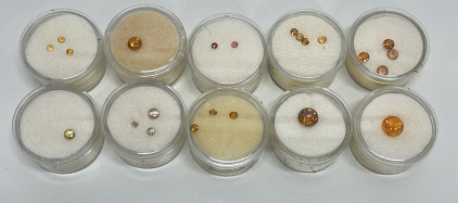 (19) Round Cut And Faceted Citrine Sizes 8mm To 2.5mm, (4) Round Cut And Faceted Sapphires Sizes 4mm To 2.5mm