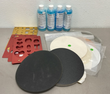 (1) 10” x .039 x 5/8” High Speed Sintered Diamond Blade, (16) 100 And 220 Grit Sanding Discs, (4) Polishing Pads, (4) Bottles Of 410-WA-108 Concentrated Wetting Agent, (5) Aluminum Gem Templates