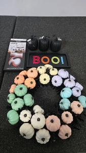 (1) Pastel Pumpkin Wreath (1) Boo Sign (1) Trick or Treat Peel and Stick (3) Black Decorative Pumpkins