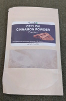 (1) 60-Bag Package Of Ginger Tea Bags, (1) 60-Bag Package Of Burdock Root Tea Bags, (1) 1.7-Oz Package Of Ceylon Cinnamon Powder, (1) 6.5-Oz Bottle Of Chilau Seasoning, (4) 2.25-Oz Cans Of Sliced Black Olives & (1) Oven Mitt/Hot Pad Set - 4