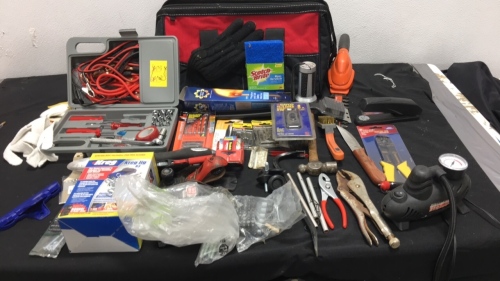 Tool bag with assorted tools and screws