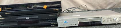 SONY DVD/CD PLAYER (TESTED DOES TURN ON), SHARP 4-HEAD VCR (TESTED DOES TURN ON), PIONEER DVD PLAYER (TESTED DOES TURN ON).