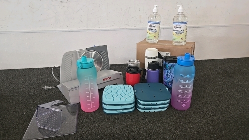 (1) Nesco Meat Slicer (5) Travel Cups (2) Water Bottles (1) Full Box of Hand Sanitizer (6) Silicone Ice Trays