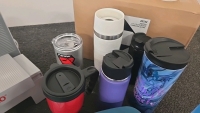 (1) Nesco Meat Slicer (5) Travel Cups (2) Water Bottles (1) Full Box of Hand Sanitizer (6) Silicone Ice Trays - 6