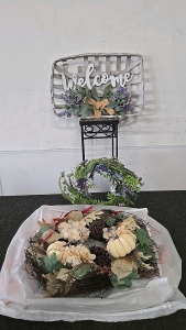 (1) Spring Wreath (1) Fall Wreath (1) Welcome Sign (1) Small Plant Stand