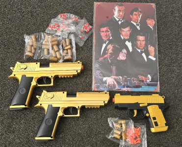 007 Metal Wall Art, (2) "Golden Gun" Airsoft Guns, (1) Kimber Airsoft Gun, (2) Video Games