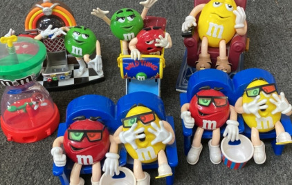 VARIETY OF M&M CANDY DISPENSERS.