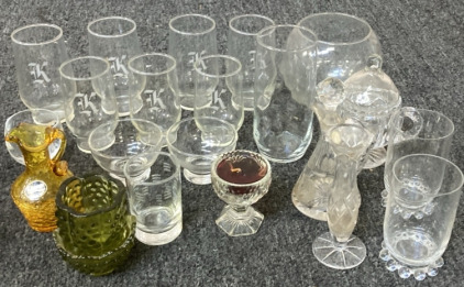VINTAGE AMBER CRACKLE CRUET PITCHER, FENTON COLONIAL HOBNAIL CANDLE STICK HOLDER, VARIETY OF CRYSTAL DRINKING GLASSES AND MORE.
