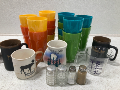 (16) Plastic Cups, (4) Mugs, 1 Measuring cup (4) Salt and pepper shakers