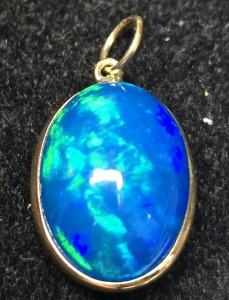 $1000 10K Blue Opal Enhanced(3.5ct) Pendant