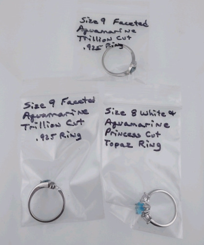 (1) Size 9 Faceted Aquamarine Trillion Cut .925 Ring, (1) Size 9 Faceted Aquamarine Trillion Cut .925 Ring, & (1) Size 8 White & Aquamarine Princess Cut Topaz Ring